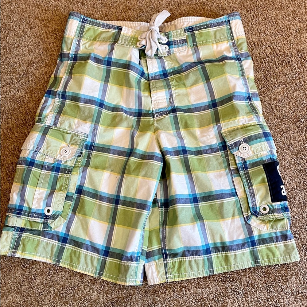 Green, blue and white plaid board shorts for boys.
